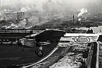 A plane flies over Detroit circa 1930s